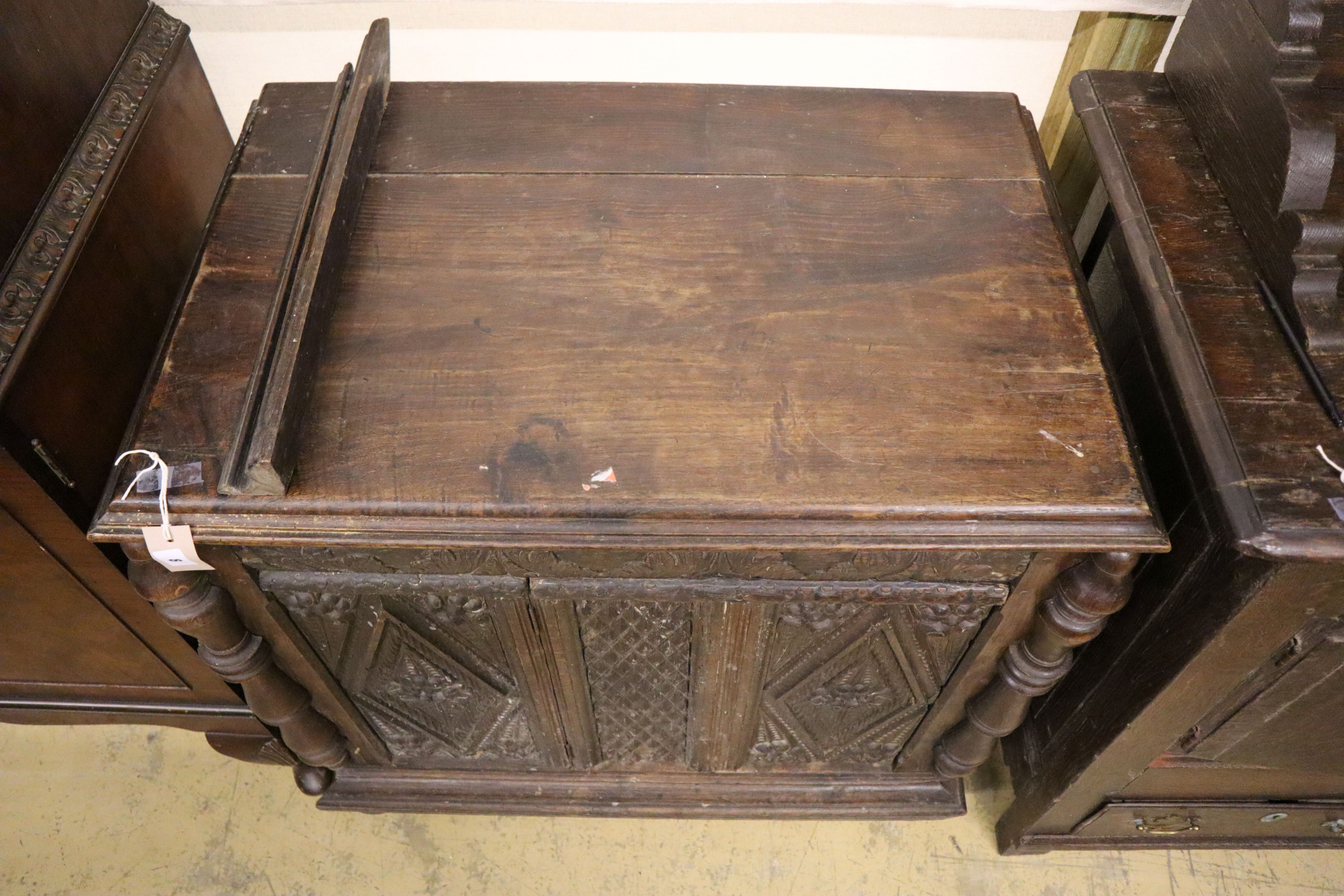 An 18th century and later carved oak side cabinet, width 83cm, depth 52cm, height 82cm